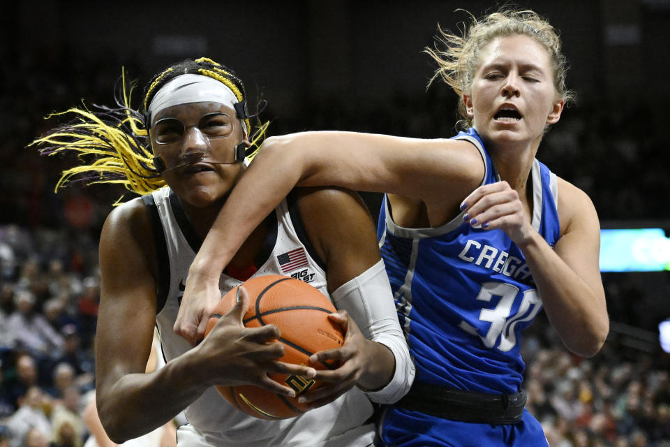 UConn's Aaliyah Edwards, left, and Creighton's Morgan Maly vie for a rebound in the second half of an NCAA college basketball game, Wednesday, Feb. 15, 2023, in Storrs, Conn. (AP Photo/Jessica Hill)