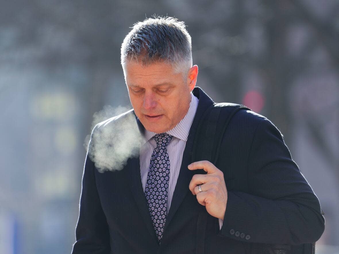 Retired vice-admiral Haydn Edmundson arrives to court in Ottawa on Feb. 8. Edmundson has been charged with one count of sexual assault and one count of committing indecent acts. He has pleaded not guilty and denied any wrongdoing.  (Sean Kilpatrick/The Canadian Press - image credit)