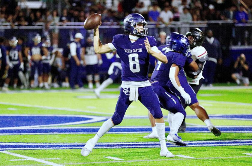 Sierra Canyon quarterback makes a pass from the pocket during a win over Oaks Christian on Friday night.