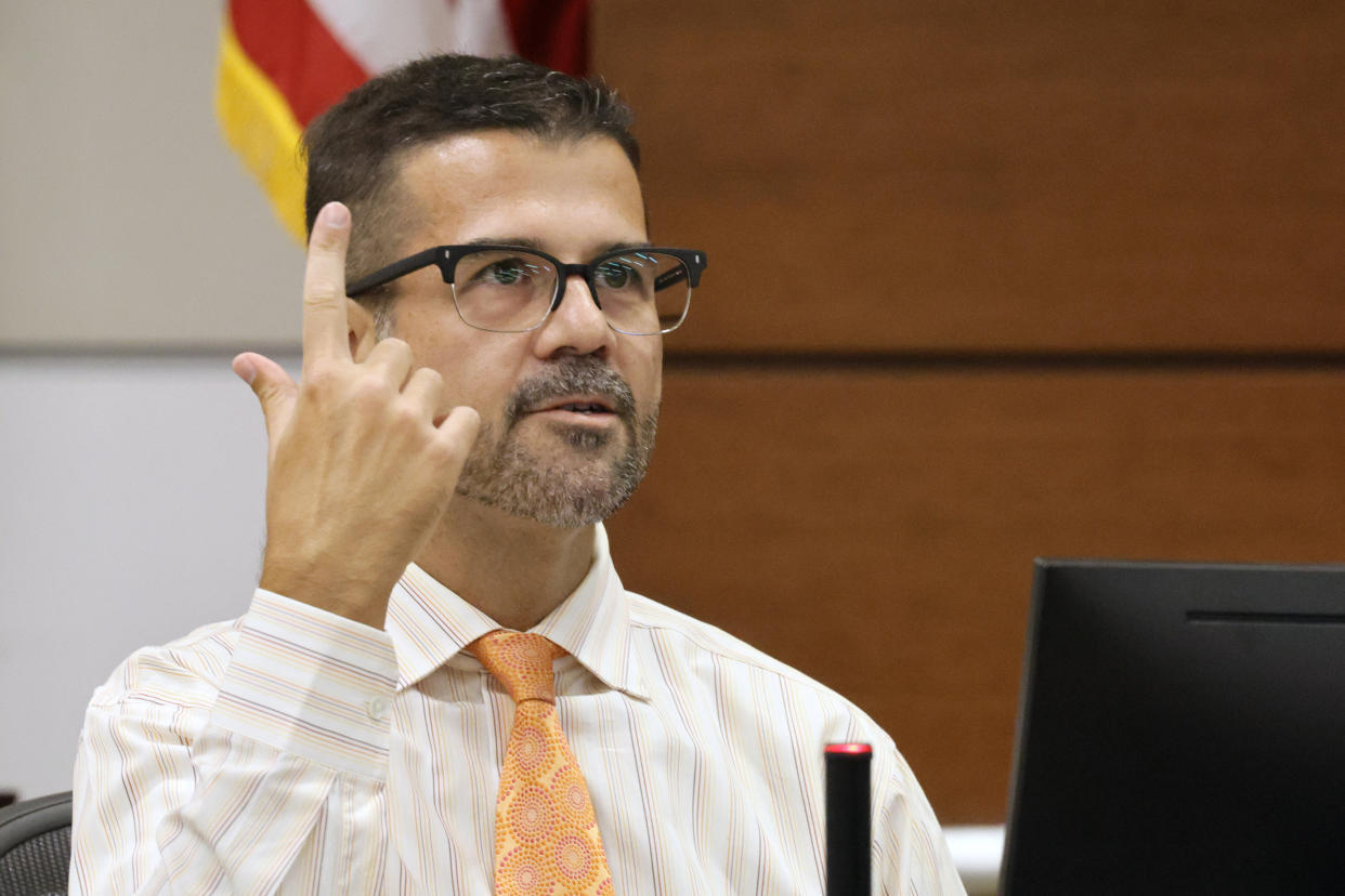 Marjory Stoneman Douglas High School teacher Michael Powell testifies in court about hearing the the school shooting on the floor above his classroom during the penalty phase of Marjory Stoneman Douglas High School shooter Nikolas Cruz's trial at the Broward County Courthouse in Fort Lauderdale, Fla., on Tuesday, July 19, 2022. His brother, Nicholas Dworet was also shot, and was killed in the rampage. Cruz previously plead guilty to all 17 counts of premeditated murder and 17 counts of attempted murder in the 2018 shootings. (Mike Stocker/South Florida Sun Sentinel via AP, Pool)