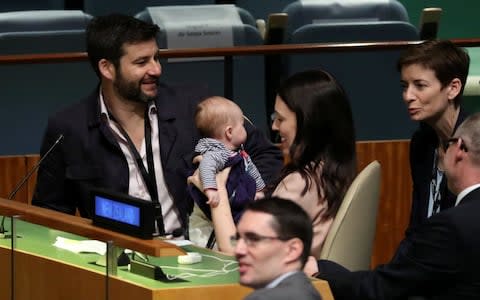 New Zealand Prime Minister Jacinda Ardern holds her baby after speaking at the UN General Assembly - Credit: REUTERS/Carlo Allegri