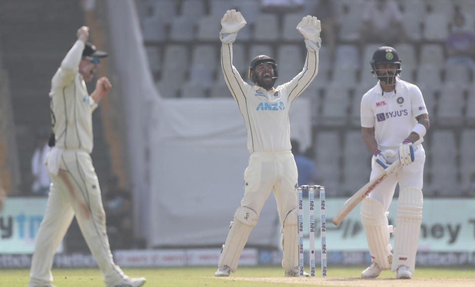 New Zealand players appeals for the dismissal of India's captain Virat Kohli, right, during the day one of second test cricket match against India in Mumbai, India, Friday, Dec. 3, 2021.(AP Photo/Rafiq Maqbool)