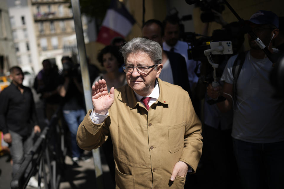 Hard-left figure Jean-Luc Melenchon leaves after voting in the first round of the parliamentary election, Sunday, June 12, 2022 in Marseille, southern France. French voters are choosing lawmakers in a parliamentary election as President Emmanuel Macron seeks to secure his majority while under growing threat from a leftist coalition. (AP Photo/Daniel Cole)