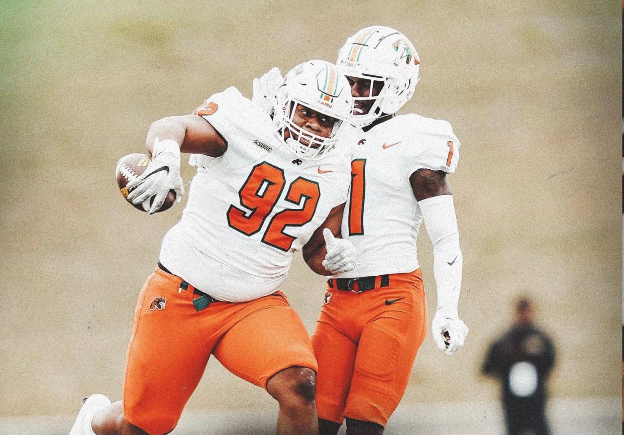 Florida A&M University defensive lineman Gentle Hunt (92) celebrates a fumble recovery with safety Lovie Jenkins against Alabama State at New ASU Stadium, Nov. 12, 2022