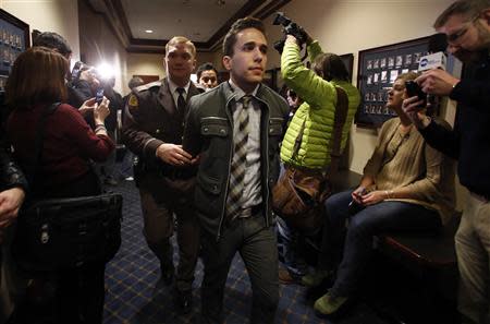 LGBT rights activist are detained by members of the Utah Highway Patrol after blocking a Senate committee hearing room at the Utah State Capitol, February 10, 2014, in Salt Lake City, Utah. REUTERS/Jim Urquhart