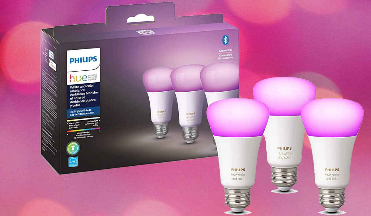 Three pink bulbs in front of packaging, on a pink flash background