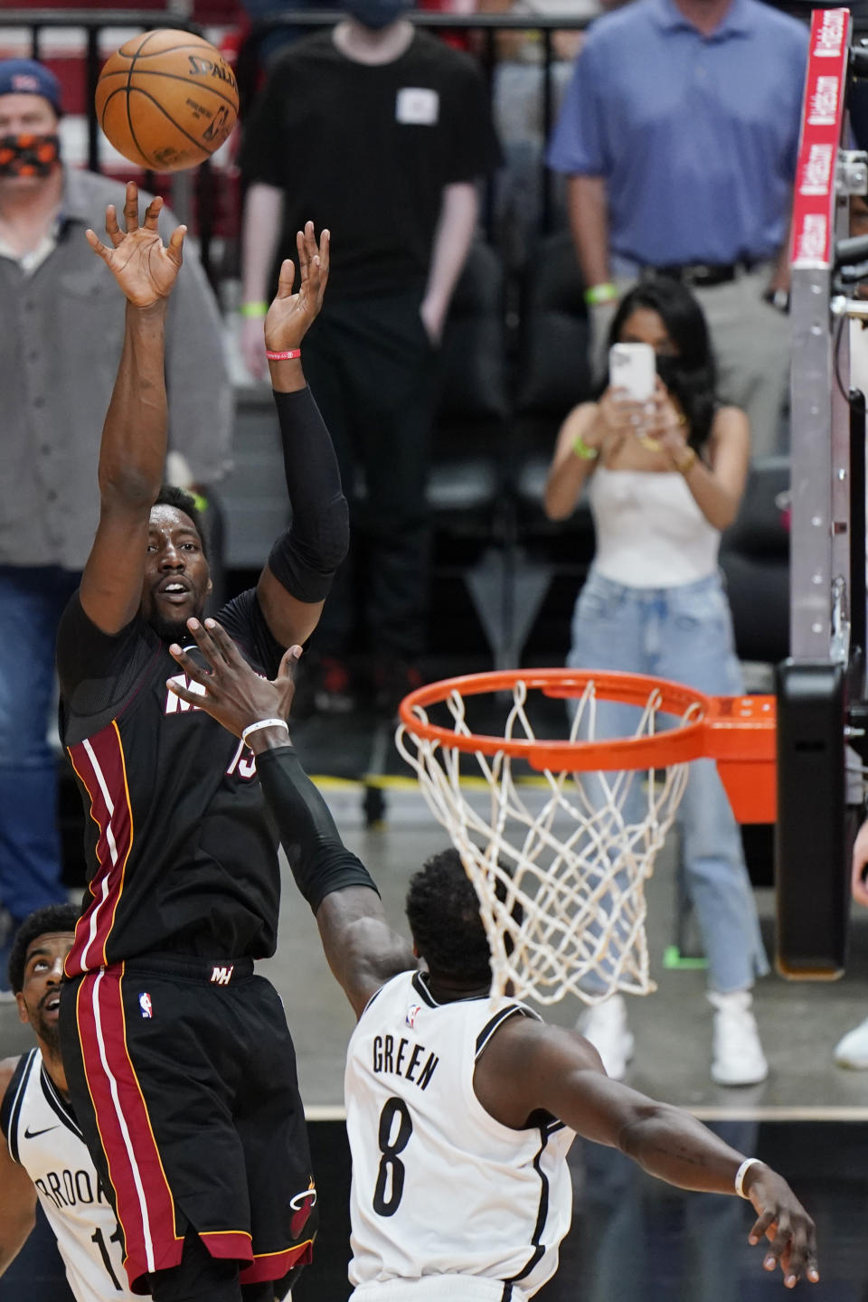 Miami Heat center Bam Adebayo, rear, makes the winning shot against Brooklyn Nets forward Jeff Green (8) at the end of the second half of an NBA basketball game, Sunday, April 18, 2021, in Miami. (AP Photo/Wilfredo Lee)