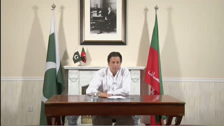 Cricket star-turned-politician Imran Khan, chairman of Pakistan Tehreek-e-Insaf (PTI), gives a speech as he declares victory in the general election in Islamabad, Pakistan, in this still image from a July 26, 2018 handout video by PTI. PTI handout/via REUTERS TV