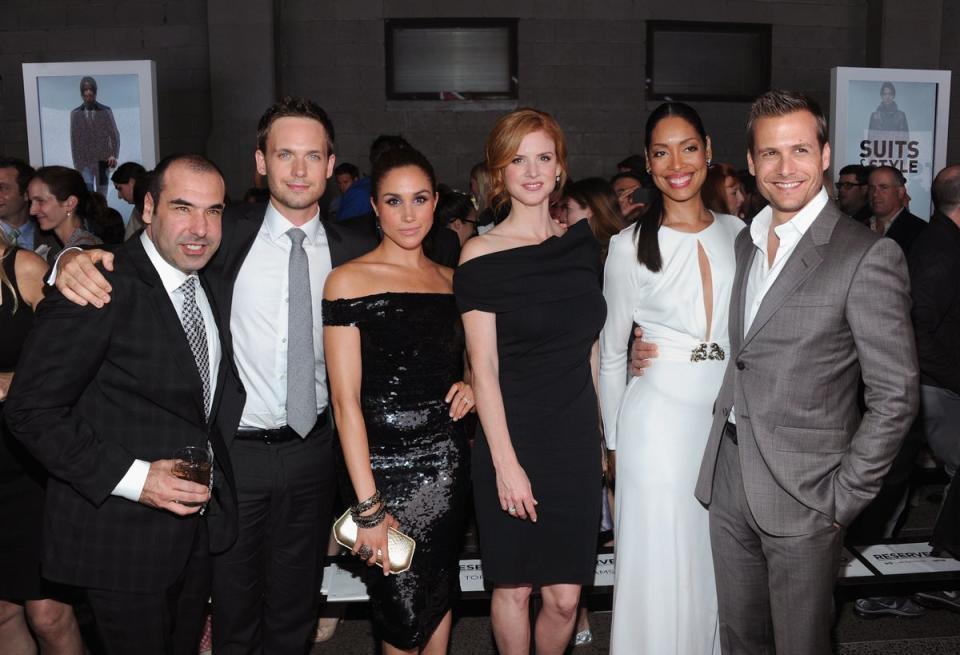 (L-R) Rick Hoffman, Patrick J. Adams, Meghan Markle, Sarah Rafferty, Gina Torres and Gabriel Macht of Suits attend USA Network and Mr Porter.com Present “A Suits Story” on June 12, 2012 (Getty)