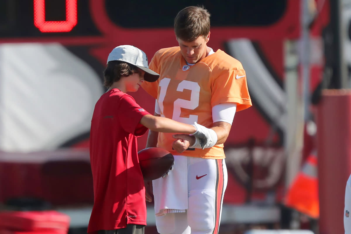 Brady's oldest son, Jack, with the Buccaneers star during training camp in Tampa last August. (Icon Sportswire / Getty Images)
