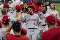 Cincinnati Reds players come off the field after game two of a baseball doubleheader against the Kansas City Royals Wednesday, Aug. 19, 2020, in Kansas City, Mo. (AP Photo/Charlie Riedel)