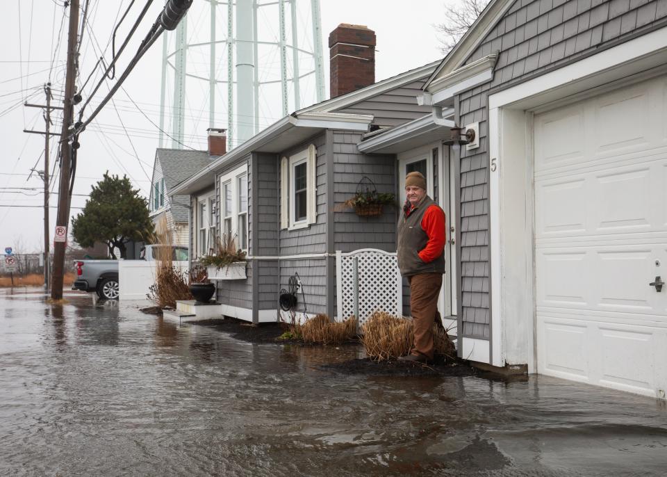 Frank Annaldo stands in front of his house on the corner of Highland and Brown Avenue at Hampton Beach on Saturday, Jan. 13, 2024.