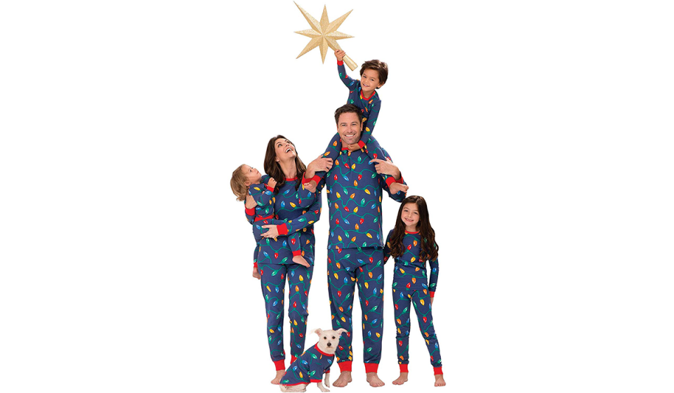 Family and dog in matching Christmas-lights pajamas (Photo: Amazon)