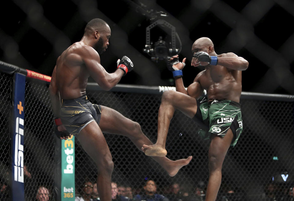 Leon Edwards, left, in action against Kamaru Usman during their welterweight title bout during UFC 286 mixed martial arts event at O2 Arena, in London, Saturday, March 18, 2023. (Kieran Cleeves/PA via AP)