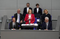 Baerbel Bas, center, speaks after she was elected new parliament president during the first plenary session of the German parliament Bundestag after the elections, Berlin, Tuesday, Oct. 26, 2021.(Photo/Markus Schreiber)