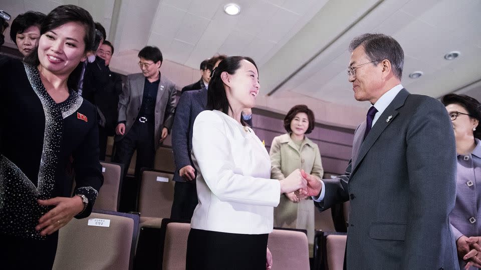 South Korean President Moon Jae-in (right) shakes hands with Kim Yo-Jong (middle), North Korean leader Kim Jong-Un's sister, in 2018. - Handout/South Korean Presidential Blue House/Getty Images