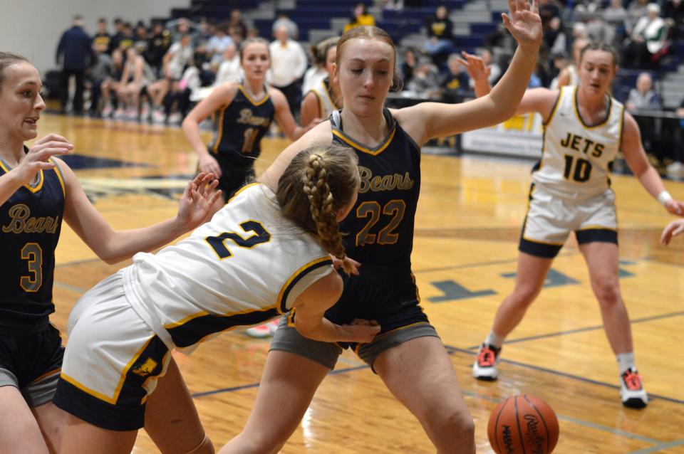 Airport's Olivia Gratz (2) tries to pass the ball to teammate RaeAnn Drummond (10) as Avery Patrick defends for Wyandotte Roosevelt during a 58-21 Airport win Tuesday night.