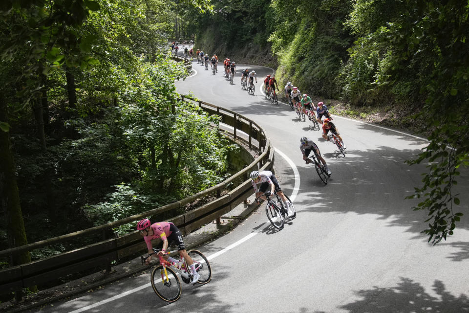 The pack speeds down Col de Valico Tre Faggi during the first stage of the Tour de France cycling race over 206 kilometers (128 miles) with start in Florence and finish in Rimini, Italy, Saturday, June 29, 2024. (AP Photo/Jerome Delay)