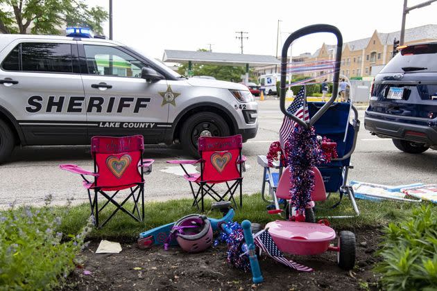 Chairs and scooters left behind at the scene of a mass shooting on the Fourth of July parade route Monday, July 4, 2022, in Highland Park. (Brian Cassella/Chicago Tribune/Tribune News Service via Getty Images) (Photo: Chicago Tribune via Getty Images)