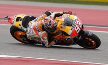 Marc Marquez of Spain leans into Turn 6 during the Grand Prix of the Americas MotoGP motorcycle race, Sunday, April 13, 2014, in Austin, Texas. Marquez won the race. (AP Photo/Tony Gutierrez)