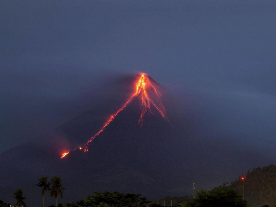 Lava continues to cascade down the slopes of the Mount Mayon volcano (AP Photo/Earl Recamunda)