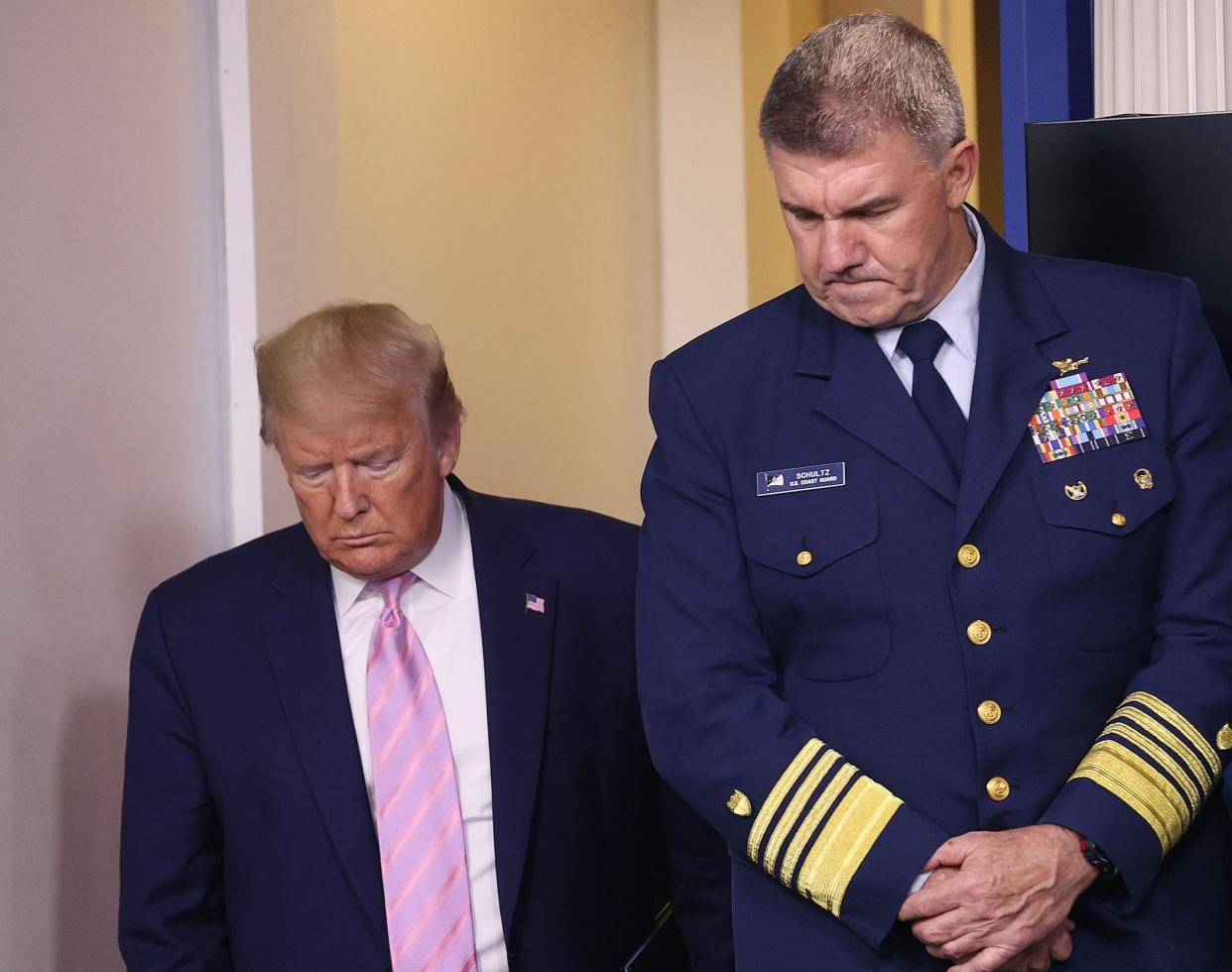 Donald Trump arrives for a White House briefing during the coronavirus pandemic as US Coast Guard Commandant Admiral Karl Schultz looks on: Getty Images