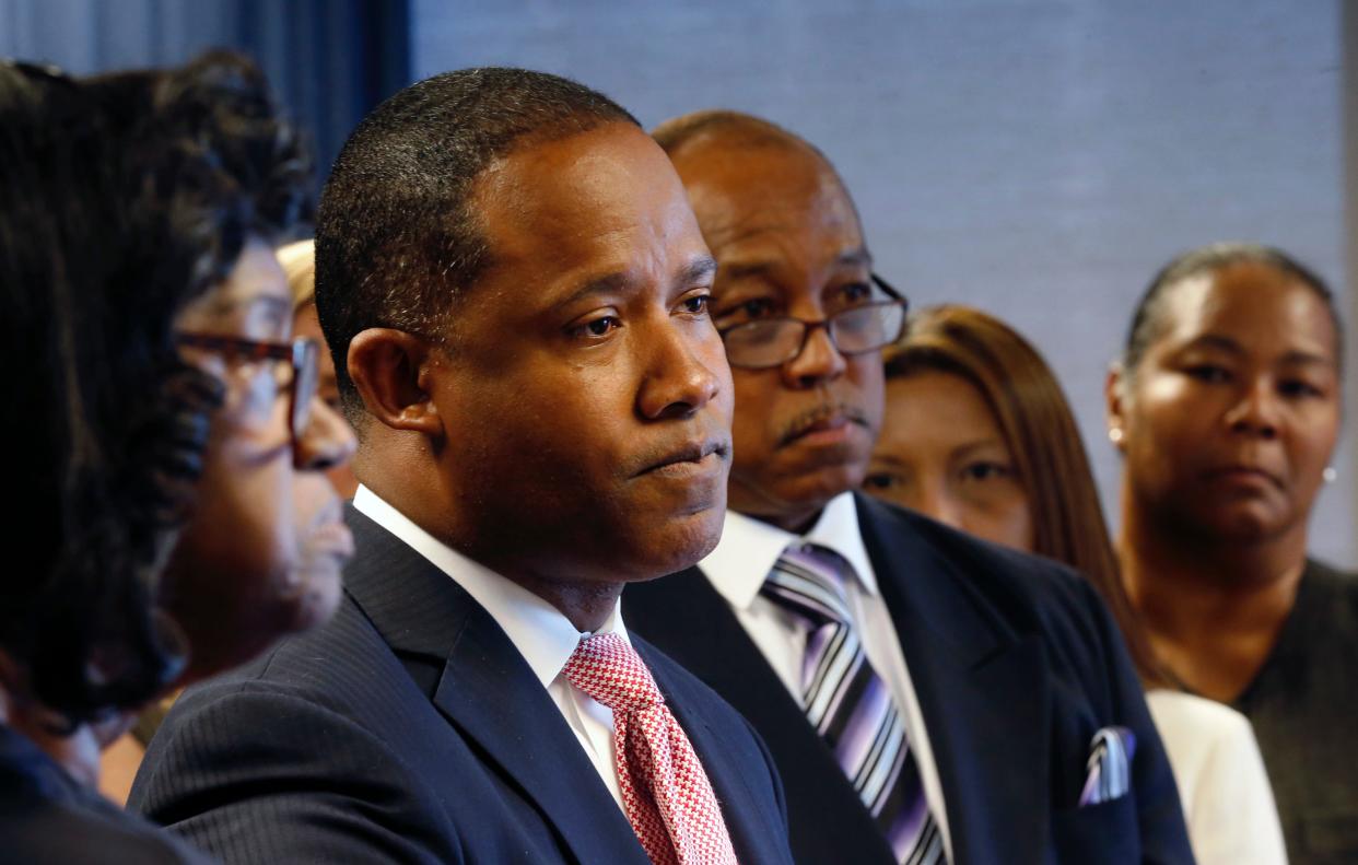 U.S. Attorney Kenneth Polite, Jr. addresses the media with victims, family members and friends in New Orleans, Wednesday, April 20, 2016.