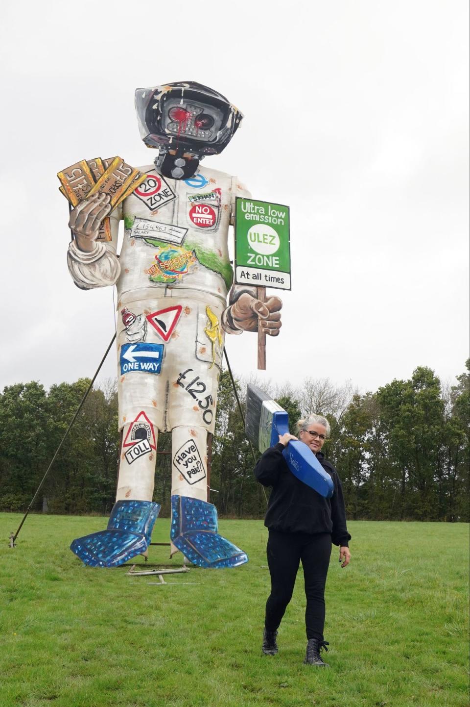 Artist Andrea Deans puts the finishing touches to Edenbridge Bonfire Society's latest celebrity guy (PA)