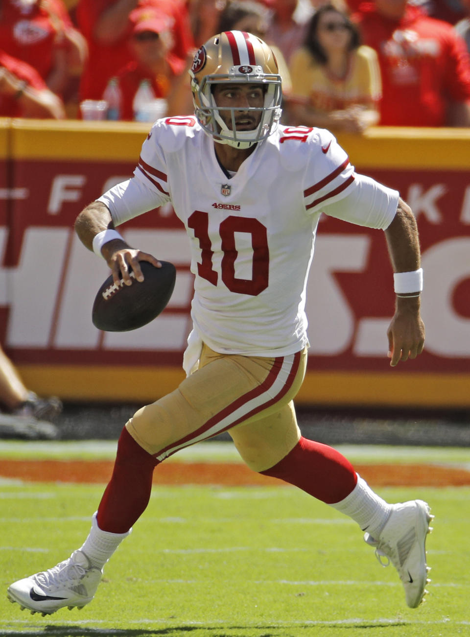 San Francisco 49ers quarterback Jimmy Garoppolo (10) carries the ball during the first half of an NFL football game against the Kansas City Chiefs in Kansas City, Mo., Sunday, Sept. 23, 2018. (AP Photo/Charlie Riedel)