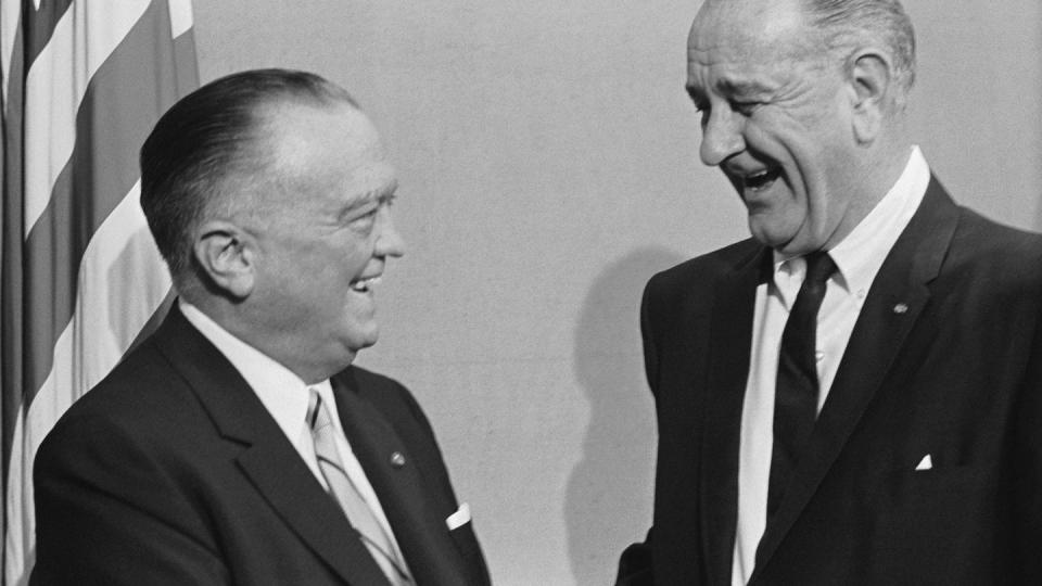 j edgar hoover and lyndon b johnson smile and laugh while looking at each other