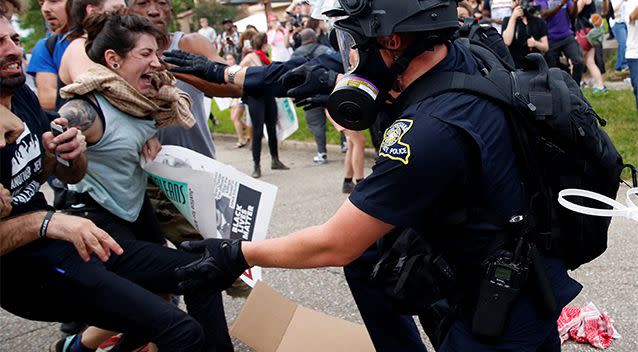 Demonstrators scuffle with police during protests in Baton Rouge. Photo: Reuters/Shannon Stapleton