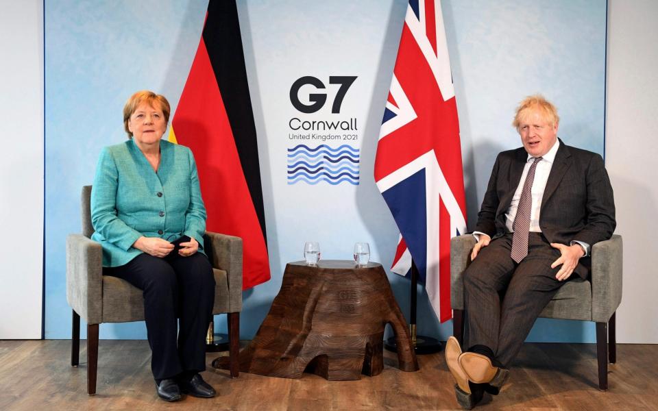 Prime Minister Boris Johnson, right, and German Chancellor Angela Merkel ahead of a bilateral meeting during the G7 summit - Stefan Rousseau/PA