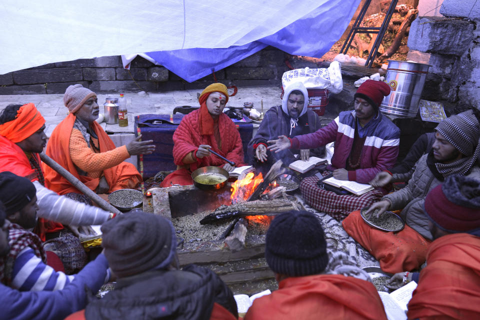 Hindu priests pray to save their town in the famed Adi Shankaracharya monastery, in Joshimath, in India's Himalayan mountain state of Uttarakhand, Jan. 20, 2023. For months, residents in Joshimath, a holy town burrowed high up in India's Himalayan mountains, have seen their homes slowly sink. They pleaded for help, but it never arrived. In January however, their town made national headlines. Big, deep cracks had emerged in over 860 homes, making them unlivable. (AP Photo/Rajesh Kumar Singh)