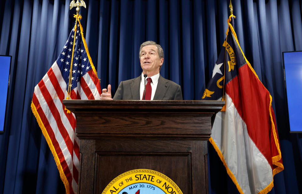 FILE - Gov. Roy Cooper talks during a press conference in Raleigh, N.C., April 24, 2024. Democratic Gov. Roy Cooper on Friday, June 21, 2024, vetoed North Carolina's masking bill that previously removed a pandemic-era exemption that allowed people to mask in public for health reasons. (Ethan Hyman/The News & Observer via AP, File)