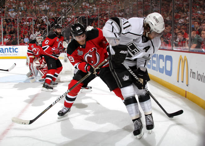  Mark Fayne #29 Of The New Jersey Devils And Anze Kopitar #11 Of The Los Angeles Kings Fight For A Loose Puck  Getty Images