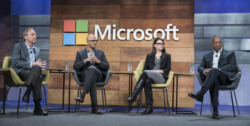 BELLEVUE, WA - DECEMBER 2: From left, Microsoft General Counsel and Executive Vice President Brad Smith Microsoft CEO Satya Nadella, Microsoft CFO and Executive Vice President Amy Hood and Microsoft Chairman of the Board John Thompson take part in the 