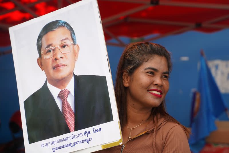 A supporter of Cambodia’s Prime Minister Hun Sen and the Cambodian People’s Party attends an election campaign for the upcoming national election in Phnom Penh