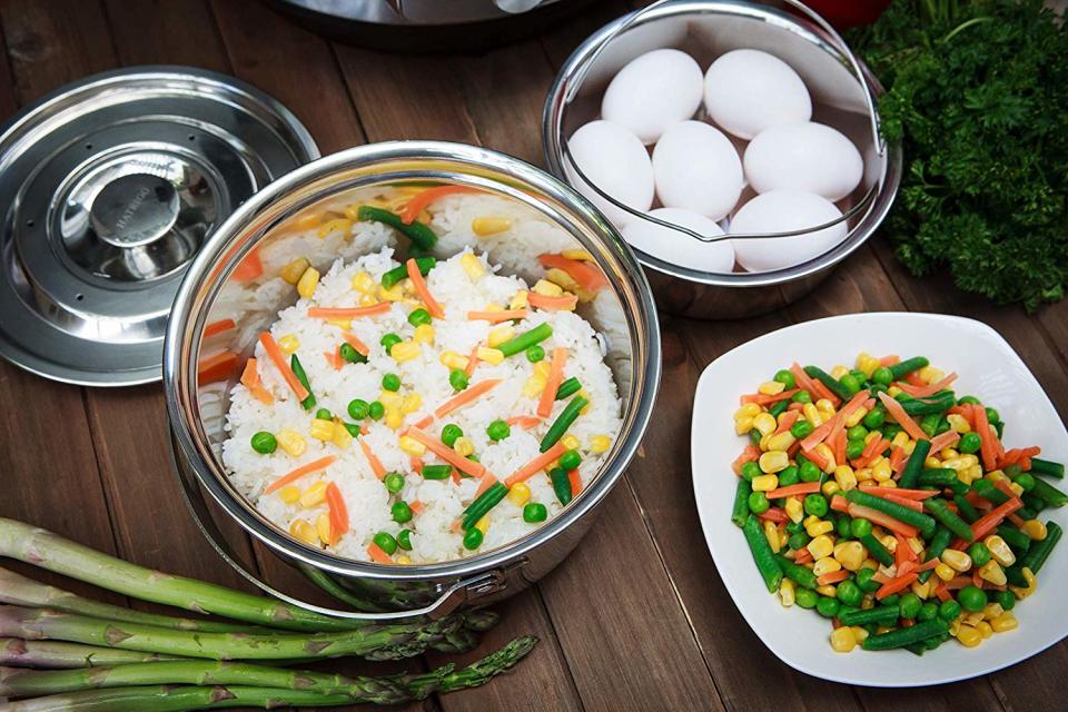 Stackable pressure cooker inserts let you cook different foods at the same time. (Photo: Amazon)