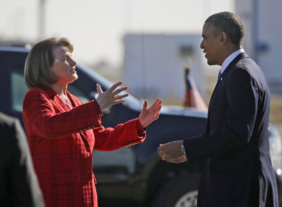 FILE - President Barack Obama and U.S. Sen. Dianne Feinstein, D-Calif., greet each other on the tarmac upon his arrival on Air Force One at San Francisco International Airport, Nov. 25, 2013. (AP Photo/Pablo Martinez Monsivais, File)