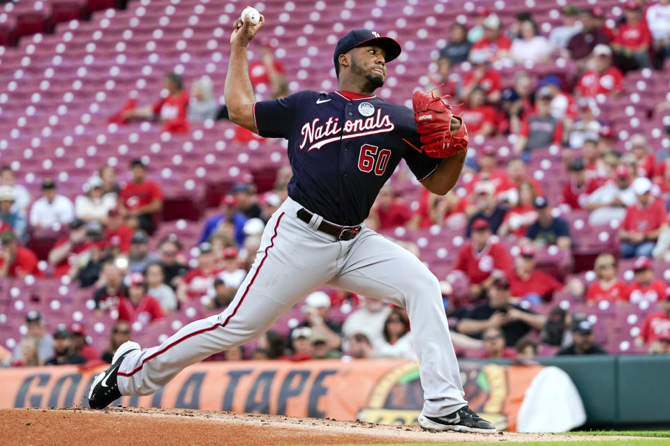 Washington Nationals starting pitcher Joan Adon (60) throws during the first inning of the team's baseball game against the Cincinnati Reds on Thursday, June 2, 2022, in Cincinnati. (AP Photo/Jeff Dean)