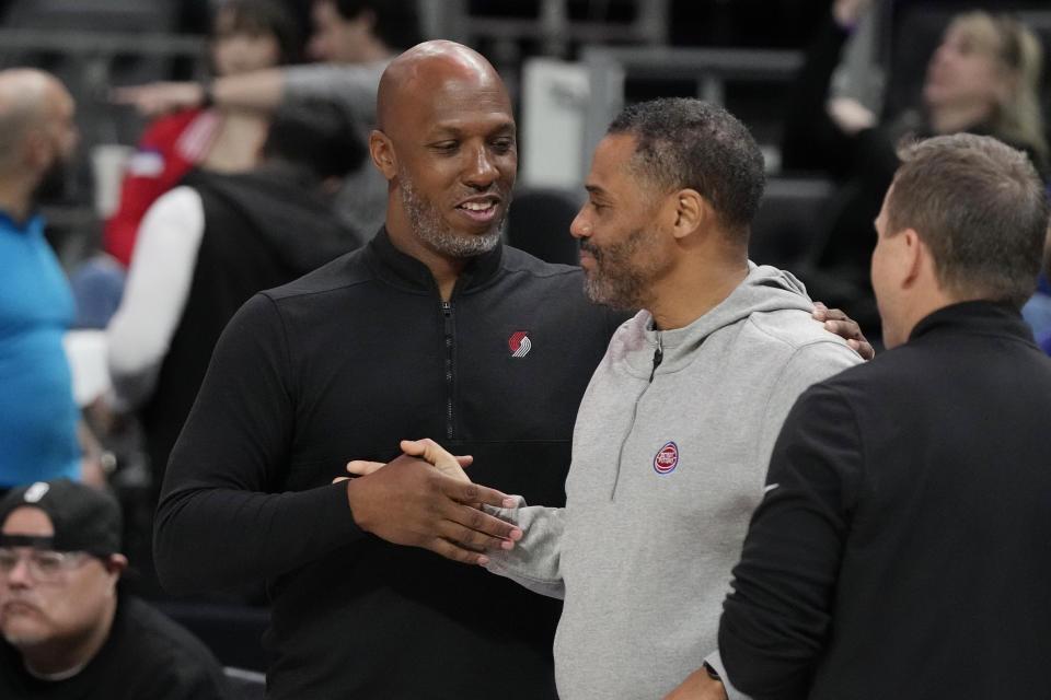 Portland Trail Blazers head coach Chauncey Billups, left, meets with Detroit Pistons General Manager Troy Weaver before the first half of an NBA basketball game, Monday, March 6, 2023, in Detroit. (AP Photo/Carlos Osorio)