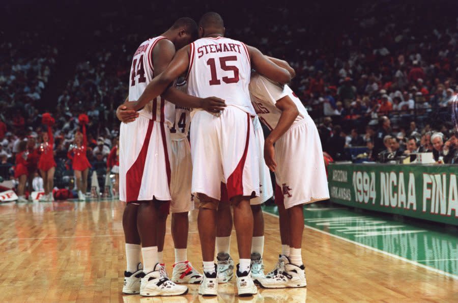 2 Apr 1994: THE ARKANSAS RAZORBACKS HUDDLE UP DURING A BREAK IN THE ACTION OF THEIR 91-82 WIN OVER ARIZONA IN THE NCAA FINAL FOUR AT THE CHARLOTTE COLISEUM IN CHARLOTTE, NORTH CAROLINA.