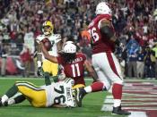 January 16, 2016; Glendale, AZ, USA; Arizona Cardinals wide receiver Larry Fitzgerald (11) scores a touchdown against Green Bay Packers during overtime in a NFC Divisional round playoff game at University of Phoenix Stadium. Mandatory Credit: Kyle Terada-USA TODAY Sports