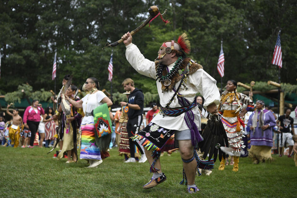 Patrick Littlewolf, of Secaucus, N.J., representing the Tuscarora Tribe, participates in an intertribal dance at Schemitzun on the Mashantucket Pequot Reservation in Mashantucket, Conn., Saturday, Aug. 28, 2021. Connecticut and a handful of other states have recently decided to mandate students be taught about Native American culture and history. (AP Photo/Jessica Hill)