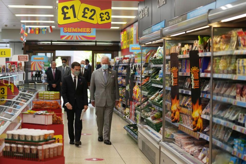 16 Photos of Queen Elizabeth, Prince Charles, and Other Royals at the Grocery Store