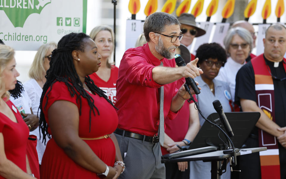 FILE - N.C. Association of Educators Vice President Bryan Proffitt speaks during a press conference held by Every Child NC in Raleigh, N.C. Wednesday, Aug. 31, 2022. A local North Carolina judge had the power to transfer large amounts of taxpayer dollars from government coffers to state agencies to carry out a plan to address longstanding education inequities, the state Supreme Court ruled on Friday, Nov. 4. (Ethan Hyman/The News & Observer via AP, File)