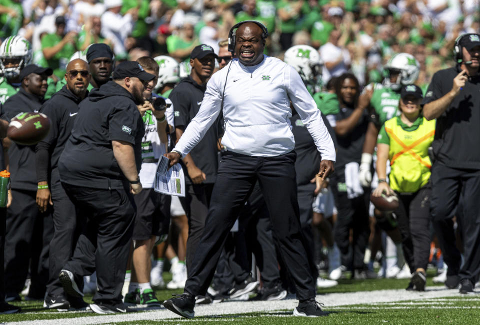 Marshall head coach Charles Huff yells from the sideline as the Herd takes on Virginia Tech during an NCAA college football game, Saturday, Sept. 23, 2023, at Joan C. Edwards Stadium in Huntington, W.Va. (Sholten Singer/The Herald-Dispatch via AP)