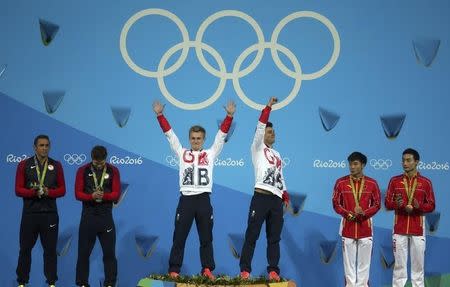 2016 Rio Olympics - Diving - Men's Synchronised 3m Springboard Victory Ceremony - Maria Lenk Aquatics Centre - Rio de Janeiro, Brazil - 10/08/2016. Jack Laugher (GBR) and Chris Mears (GBR) of United Kingdom celebrate on the podium next to Sam Dorman (USA) and Michael Hixon (USA) of USA, and Cao Yuan (CHN) and Qin Kai (CHN) of China. REUTERS/Pilar Olivares