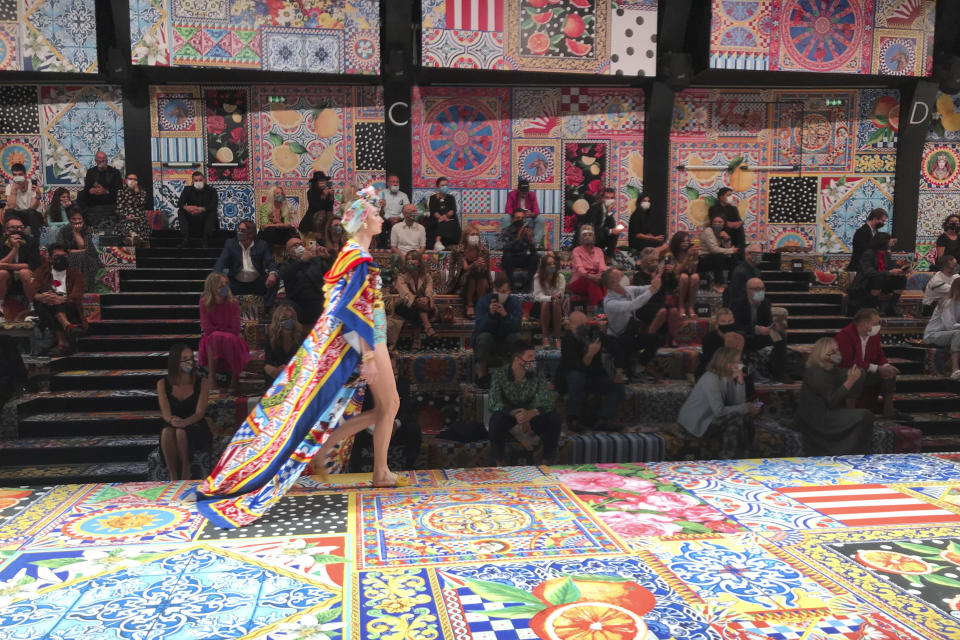 A model wears a creation as part of the Dolce & Gabbana 2021 women's spring-summer ready-to-wear collection during the Milan's fashion week in Milan, Italy, Wednesday, Sept. 23, 2020. (AP Photo/Colleen Barry)