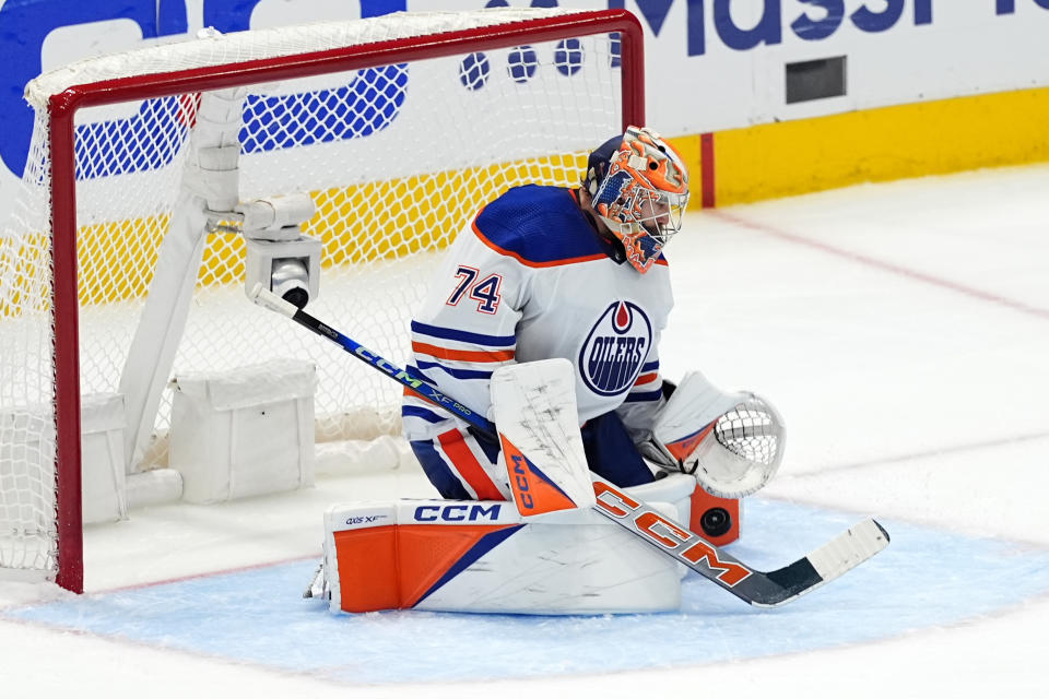 Edmonton Oilers goaltender Stuart Skinner blocks a shot from the Dallas Stars during the third period of Game 5 of the Western Conference finals in the NHL hockey Stanley Cup playoffs Friday, May 31, 2024, in Dallas. (AP Photo/Julio Cortez)